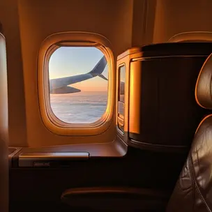 Business class cabin window view during flight